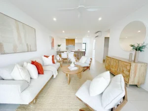 Living Room Featuring a Classy Sofa and Table Across from the Kitchen Counter | Property Staging and Styling by Sell in Style, Brisbane